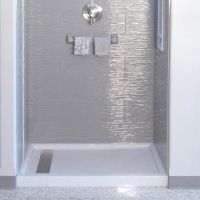 Linear drain in a solid surface shower pan - Innovate Building Solutions 