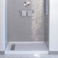 Linear drain in a solid surface shower pan - Innovate Building Solutions