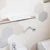 Contemporary bright chrome grab bar with a Corian shelf for soap - Innovate Building Solutions