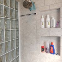 Shampoo and lotion niches in a ceramic tile shower - Innovate Building Solutions