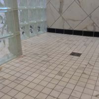 A waterproof ready for tile shower pan with a glass block wall - Innovate Building Solutions