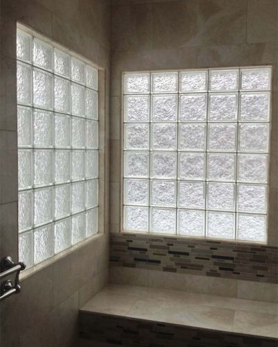 High privacy glass block shower windows with ceramic tile window trim in a ADA bathroom  - Innovate Building Solutions