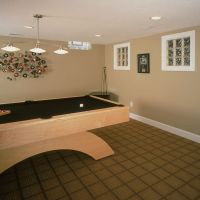Wood trim around glass block windows in a finished lower level pool room - Innovate Building Solutions - Columbus Glass Block division 