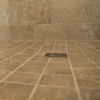 Smaller tiles in a ready for tile shower pan with a square drain - Innovate Building Solutions