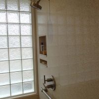 Universal design cultured granite shower with a high privacy glass block bathroom window - Innovate Building Solutions 