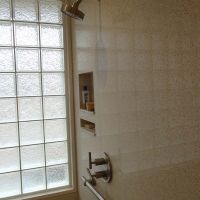 Universal design cultured granite shower with a high privacy glass block bathroom window - Innovate Building Solutions