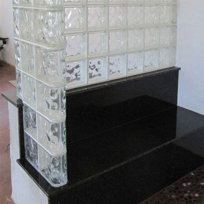 Bench seat out of granite in a tile shower