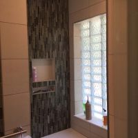 Horizontal 4 inch by 8 inch glass block in a durable shower window - Innovate Building Solutions