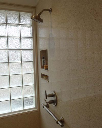 Universal design shower with glass block privacy window and easy to work lever type hardware and decorative grab bar - Innovate Building Solutions