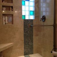 Tile shower with more light with a colored glass block premade window - Innovate Building Solutions 
